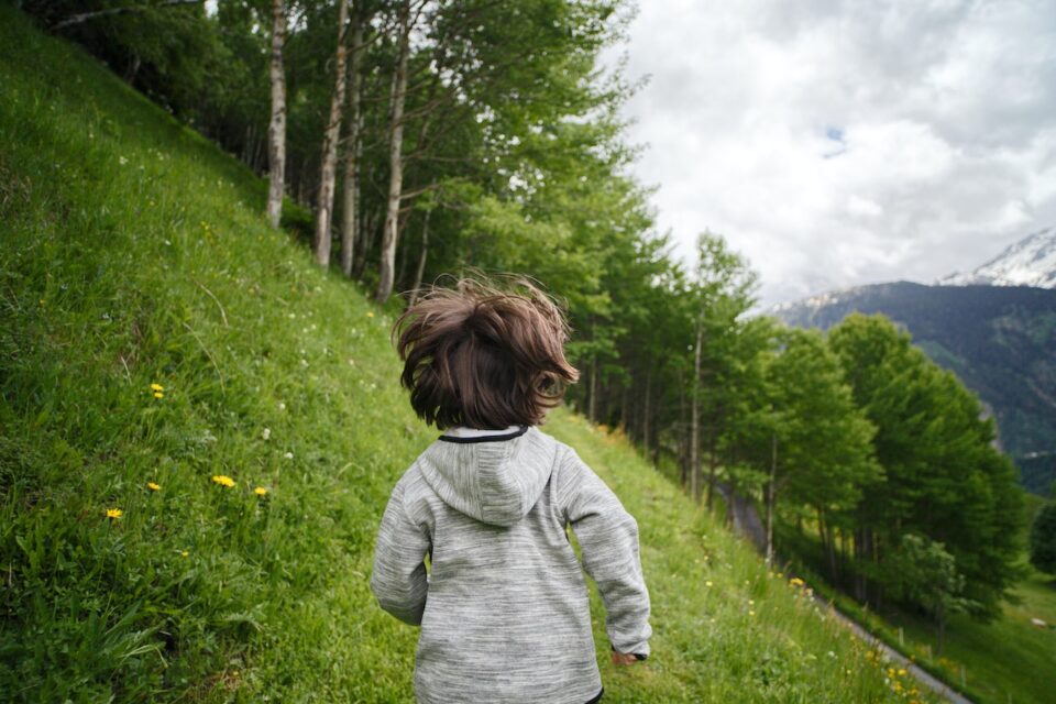 Picture of a curious child in the mountains